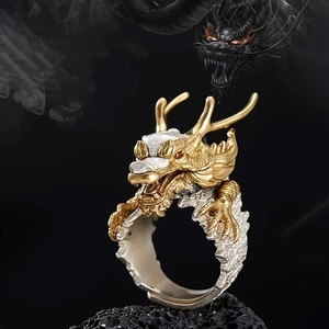 Macro detail of vintage dragon ring featuring gold plating and intricate scales