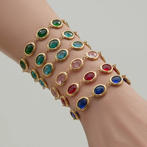 PVD gold-plated chain bracelets with multi-colored faceted oval glass stones on wrist