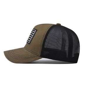 Detailed side view of vintage trucker hat featuring distressed canvas and mesh paneling