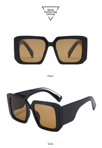 Detail view of Y2K oversized square sunglasses with black frames and tea lenses