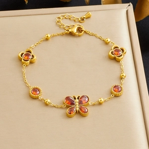 Gold stainless steel butterfly and flower bracelet with red heart zircon crystals
