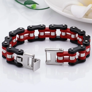 Detail of red and black bike chain bracelet with industrial stainless steel buckle