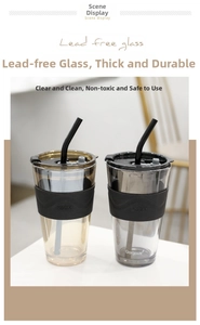 Close-up of glass tumblers featuring non-slip silicone sleeves and matching straws
