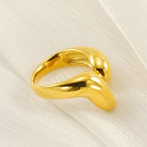 Minimalist 18k gold plated stainless steel irregular ring on white silk fabric