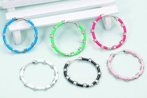 Colorful enamel hoop earrings with inlaid cubic zirconia in six vibrant assorted colors