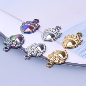 Engraved heart pendants in gold, silver and rainbow finish with floral relief detail
