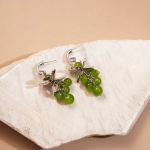 Elegant silver C-shaped grape cluster drop earrings with green glass beads and leaf charms