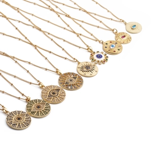 Golden Evil Eye necklaces with colorful zircon stones and sunburst textured pendants