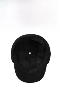 Detail view of the thick black fleece lining and cross-stitched inner structure of the hat