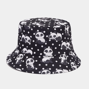 Close-up of cute panda and white polka dot prints on a black cotton bucket hat