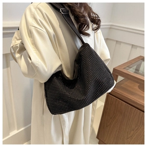 Detail of black rhinestone shoulder bag with adjustable wide strap and Boston style
