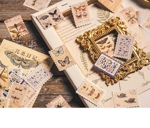Detailed view of vintage insect-themed stamp stickers for scrapbooking and DIY crafts