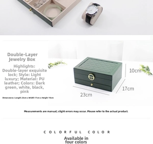 Green leather jewelry box featuring quilted lid, gold lock, and double-layer storage drawer