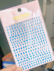 Close-up of blue 3D letter nail stickers WG719 with uppercase and lowercase designs