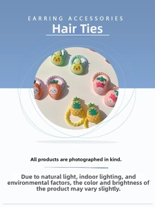Close-up of cute fruit and animal resin charms on elastic hair ties for girls