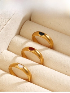 Detailed view of three 18K gold plated heart rings in black red and white shimmer finish