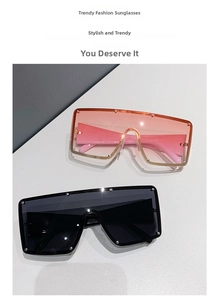 Detail of oversized square sunglasses with silver studs on pink and black gradient lenses