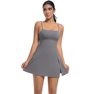 Detail view of the side slit on a gray backless tennis dress with moisture-wicking fabric