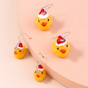 Detail showing cute yellow duck earrings with red Christmas hats and festive metal hooks