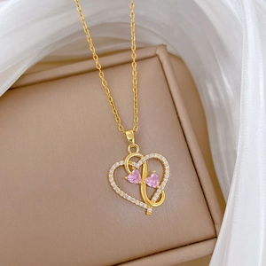 Gold stainless steel double heart necklace with pink gemstones and pavé crystals