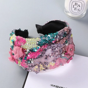 Wide pink headband with colorful sequins, pearls, and lace flower embroidery details