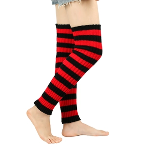 Detail of red and black striped knit leg warmers with vintage punk style texture