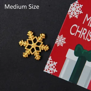 Macro shot of medium sized golden glitter snowflake charm for DIY Christmas crafts