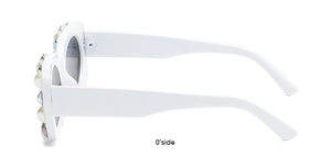 Side view of white square sunglasses with pearls and rhinestones on the frame