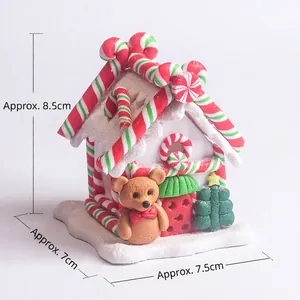 Light-up polymer clay gingerbread house Christmas ornament with candy and bear details