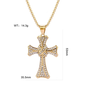 Macro detail of gold cross pendant with cubic zirconia stones showing 53mm by 35.5mm size
