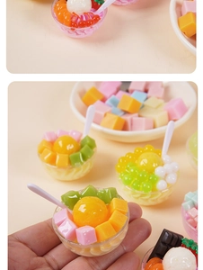 Close-up of mini resin fruit dessert bowl model with colorful cream and tiny spoon