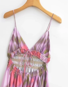 Detail of V-neck tie-back design on purple tie-dye print slip dress for women
