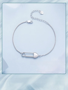 Detailed view of S925 sterling silver heart pin bracelet with sparkling cubic zirconia