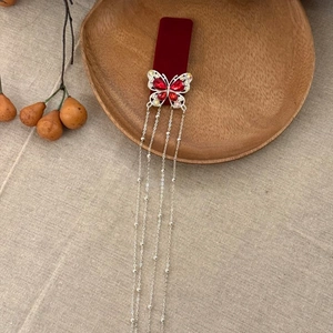 Elegant red velvet butterfly hair clip with rhinestones and long beaded tassels
