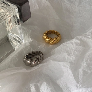 Retro titanium steel croissant ring set in gold and silver colors on white background