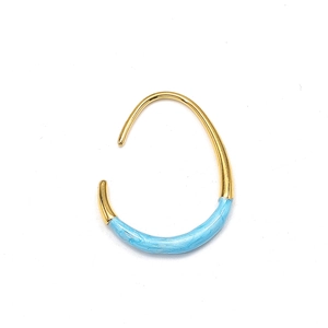 Close-up of gold titanium steel U-shaped earrings with light blue enamel dripping oil detail
