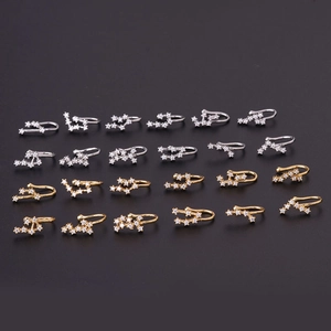 Set of 24 zodiac copper ear clips with cubic zirconia in gold and silver finishes