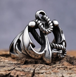 Vintage stainless steel anchor and rope nautical ring on a wooden stand in silver finish