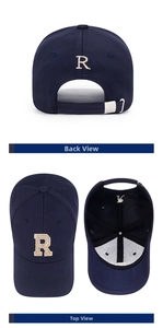 Detail view of navy baseball cap featuring golden R embroidery and metal adjustable buckle
