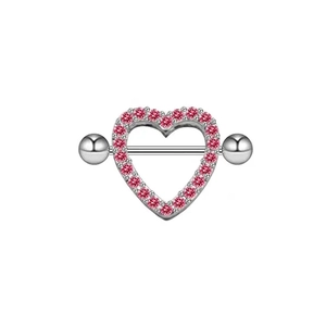 Close-up of silver stainless steel heart nipple shield with pink gemstone inlay detail