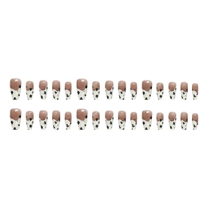 Medium coffin ballerina press-on nails with black and white cow print French tips