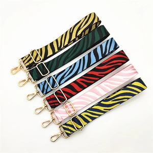 Adjustable zebra pattern crossbody straps with gold hardware in multiple colorways