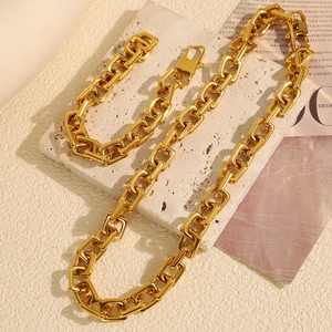 Statement chunky U-link 18k gold plated necklace and bracelet jewelry set on stone
