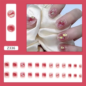 Detail of burgundy gradient press-on nails with 3D rectangular crystal gems Z336 set