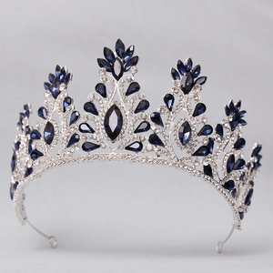 Detail of silver bridal crown featuring deep blue crystal stones and clear rhinestones