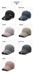 Detail showing various colors of baseball caps with minimalist NALAS letter embroidery