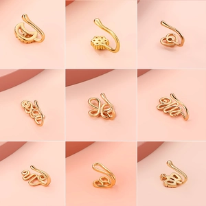 Golden non-pierced U-shaped nose clips with heart, moon, and butterfly zircon designs