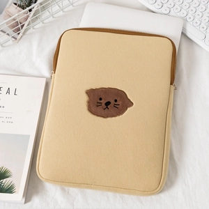 Light brown padded laptop sleeve with cute animal embroidery and secure zipper closure