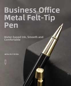 Detail of metal rollerball pen tip with gold clip and smooth water-based ink flow