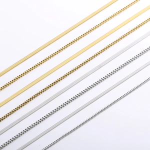 Detail of gold and silver box chains and snake chains with polished metallic textures